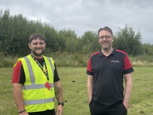 two Tai Calon employees smiling