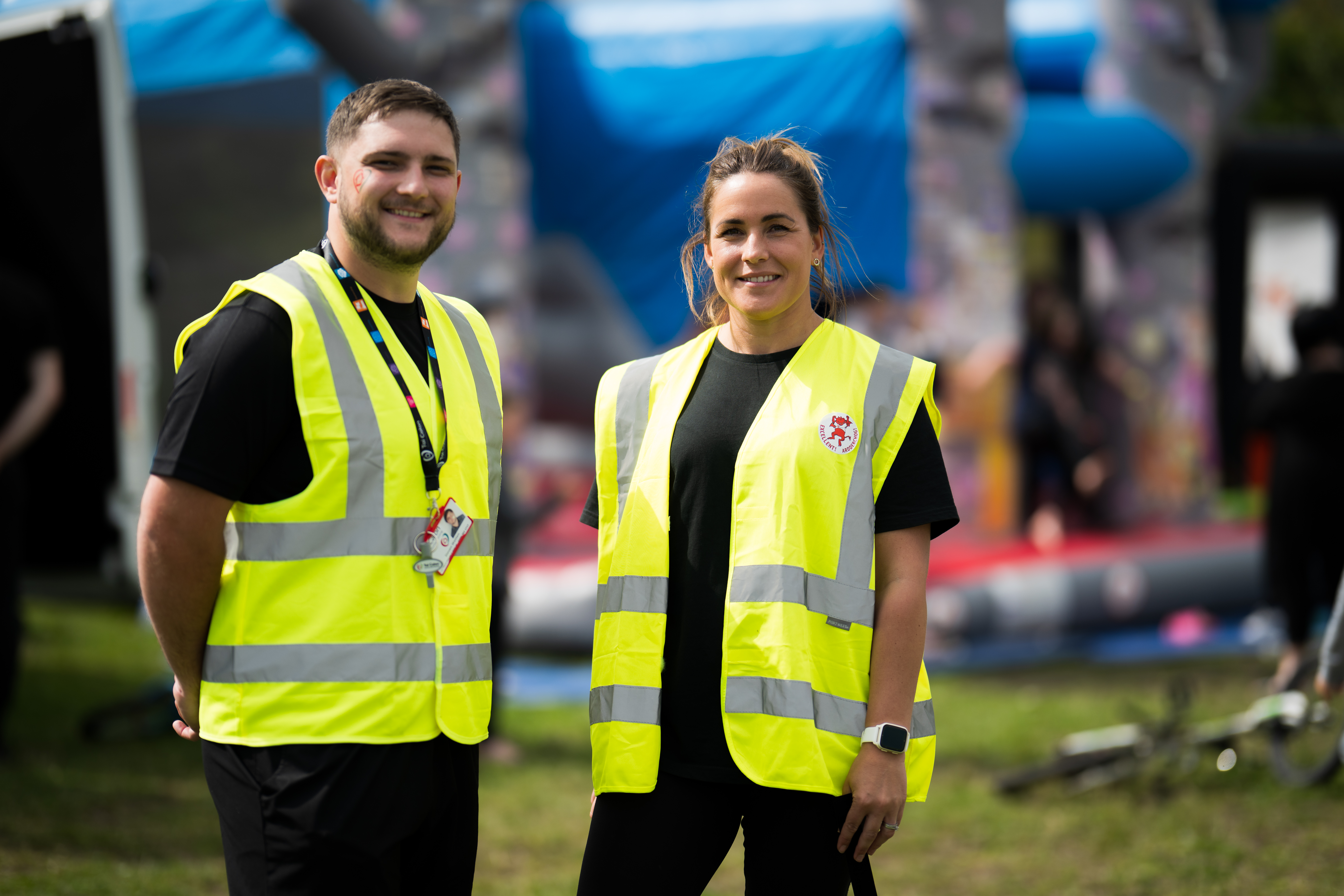 Two Tai Calon team members one male one female both smiling